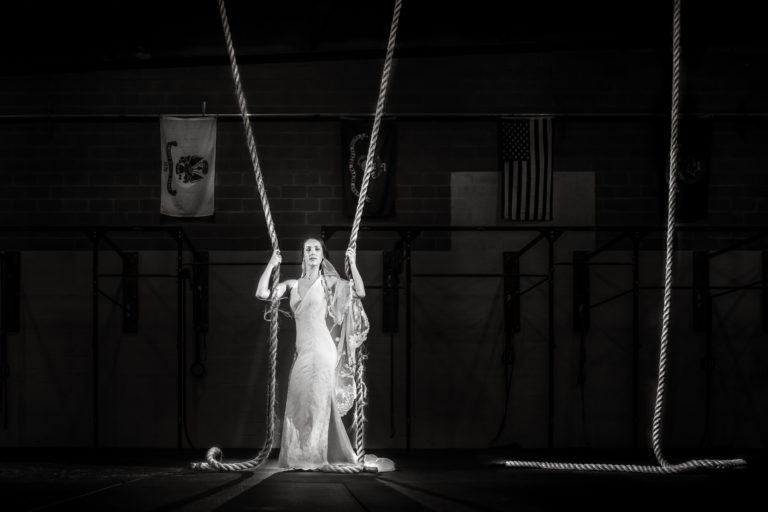 See image of bride taken during her bridal session in a Crossfit Gym in New Bern, NC